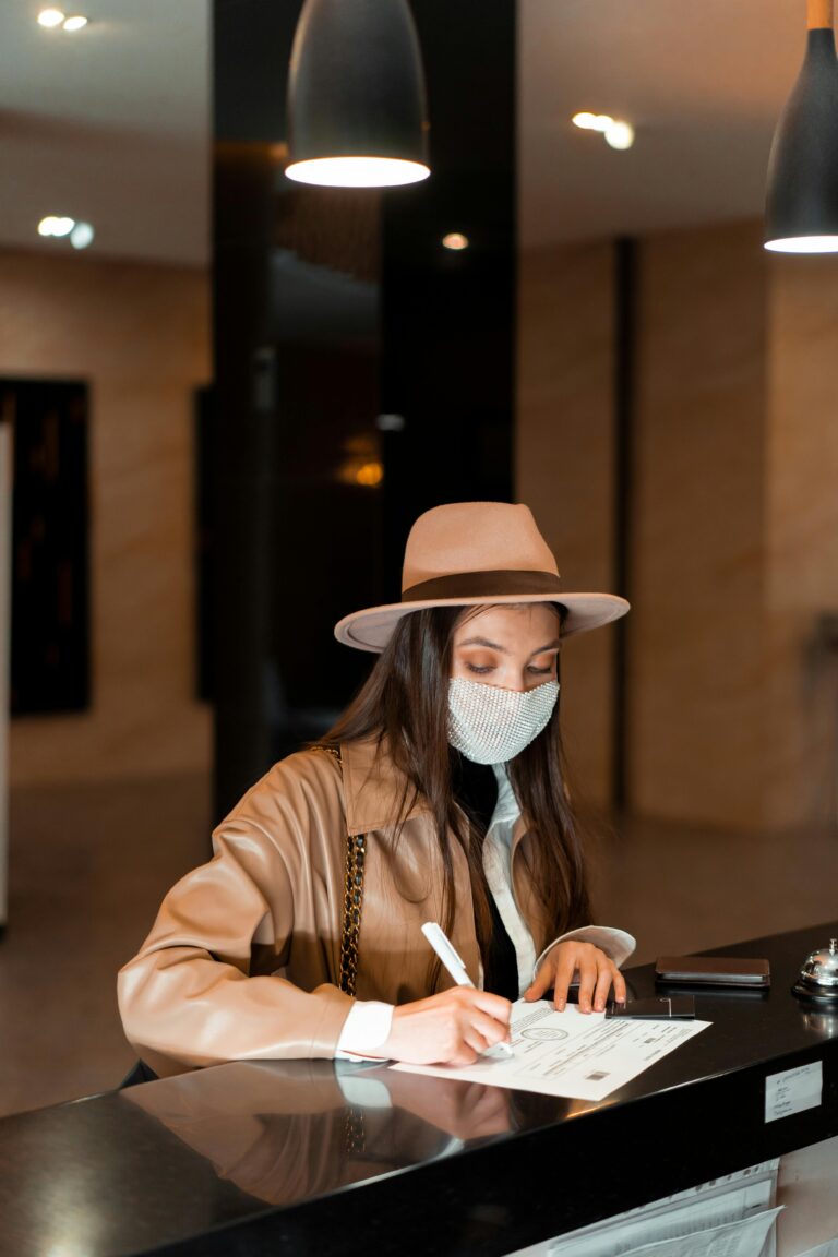 Woman in Brown Leather Jacket and Brown Hat